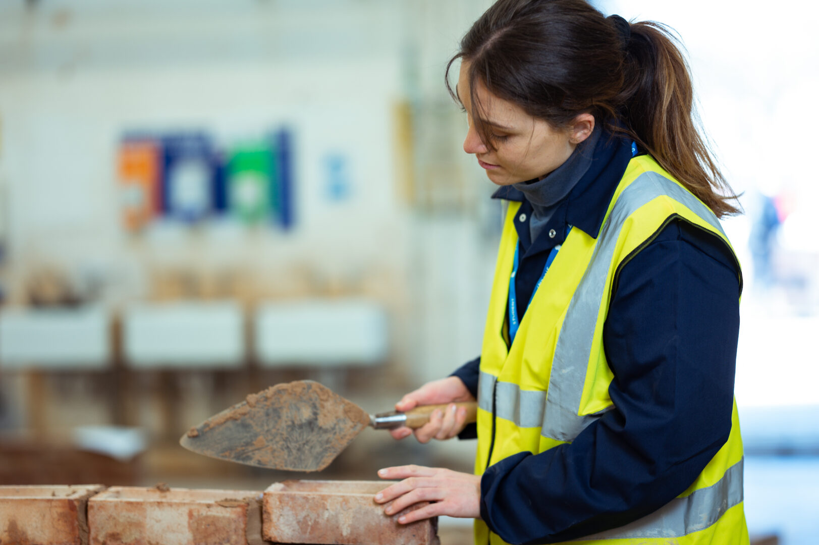 construction student completing a brickwork task