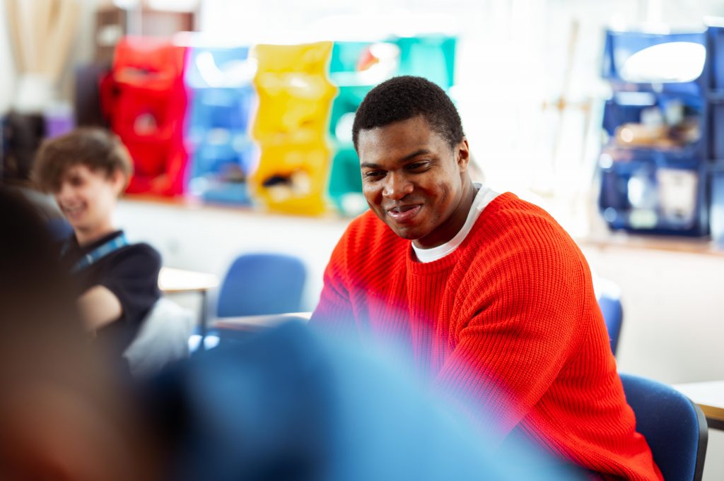 a student sat in a classroom learning