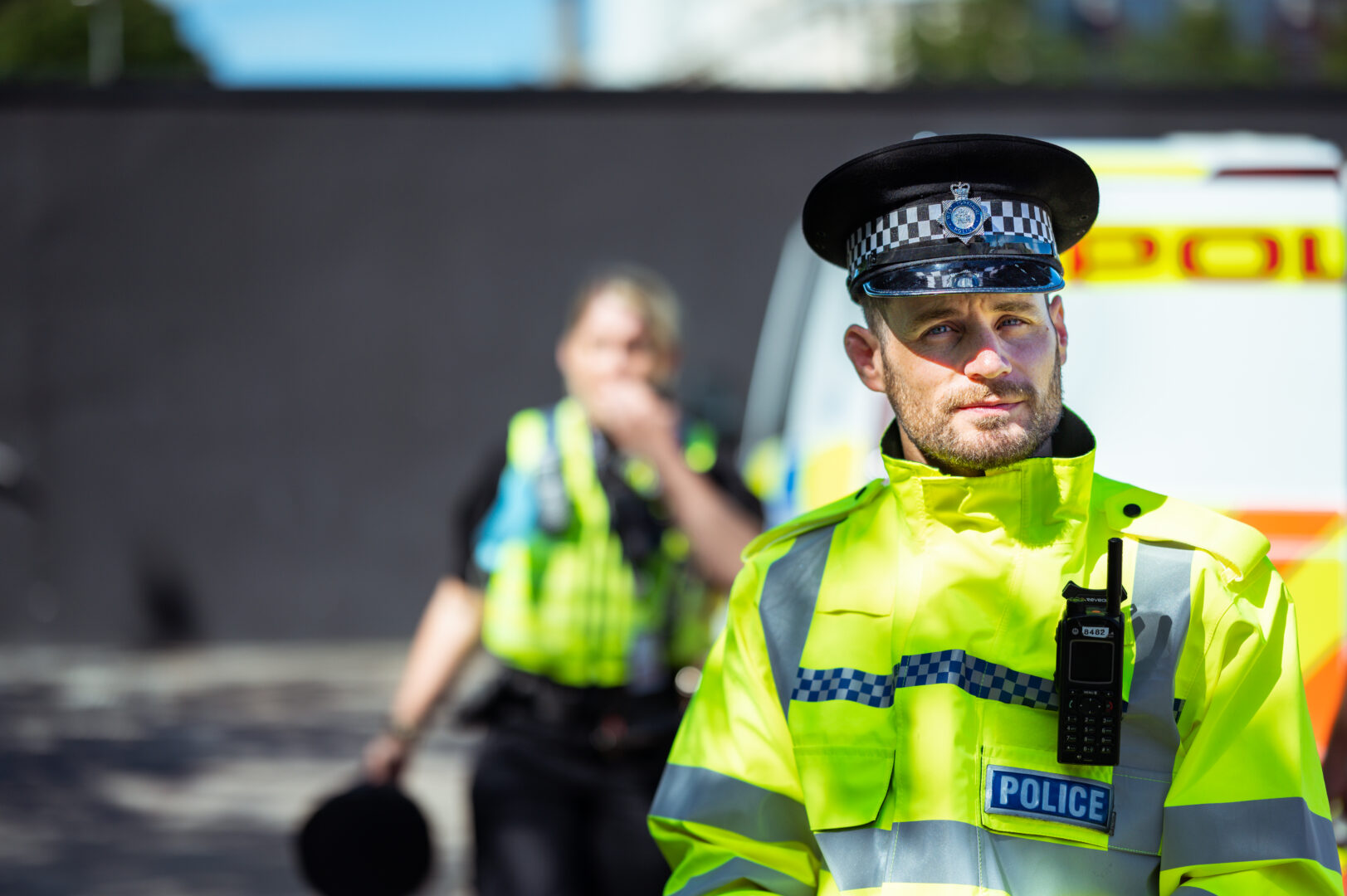 public services student wearing a police officer's uniform and hat