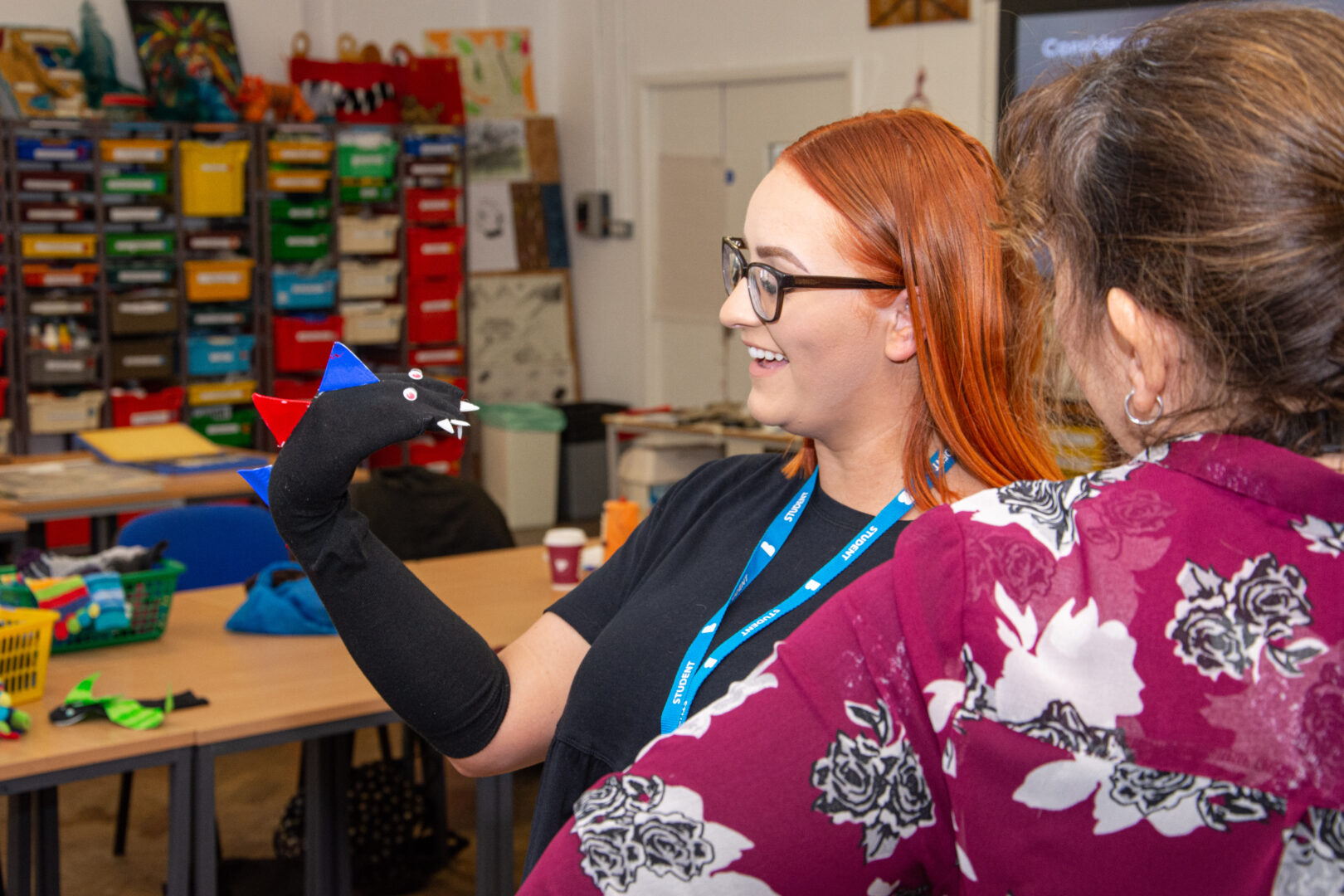 childcare student holding a puppet