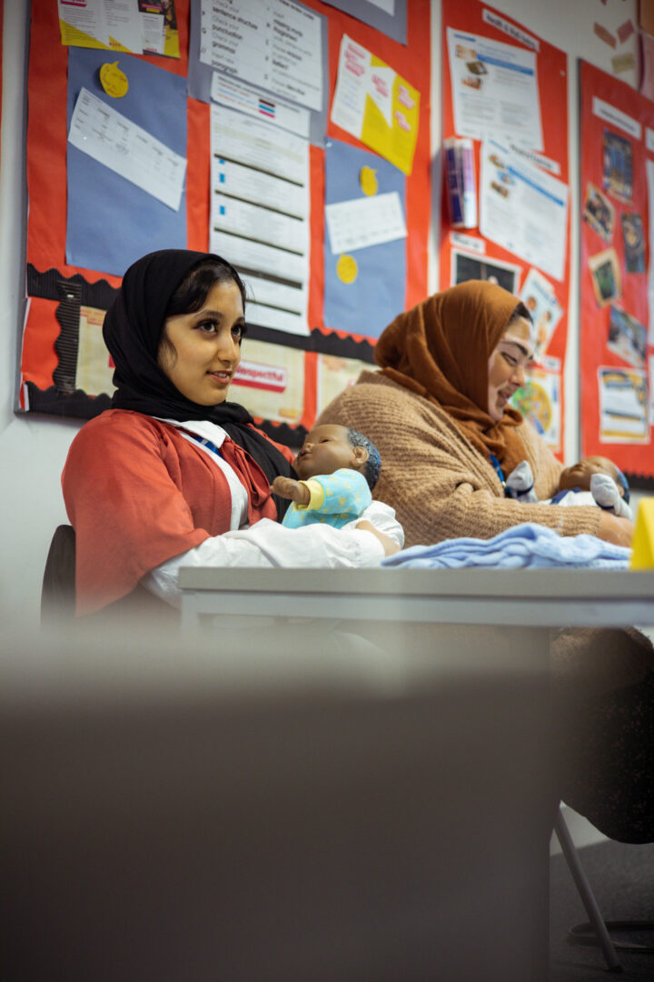 childcare students holding ebabies
