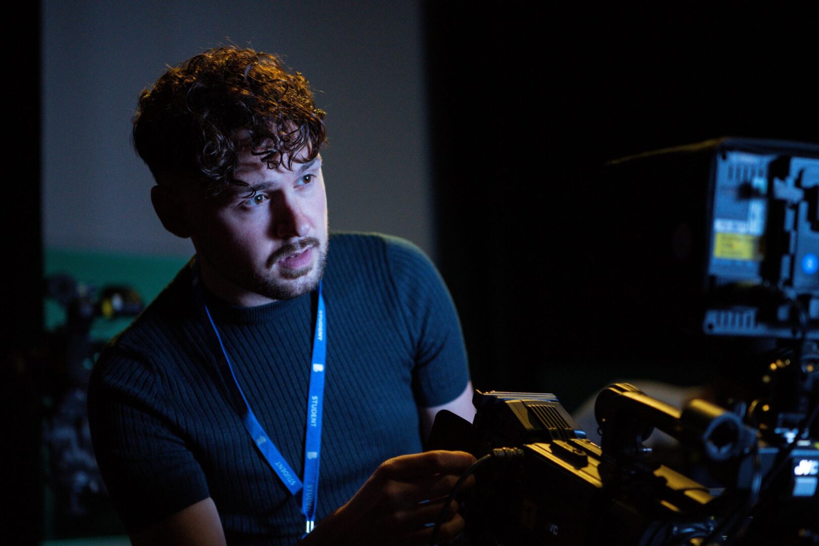 production student filming in our media room facilities