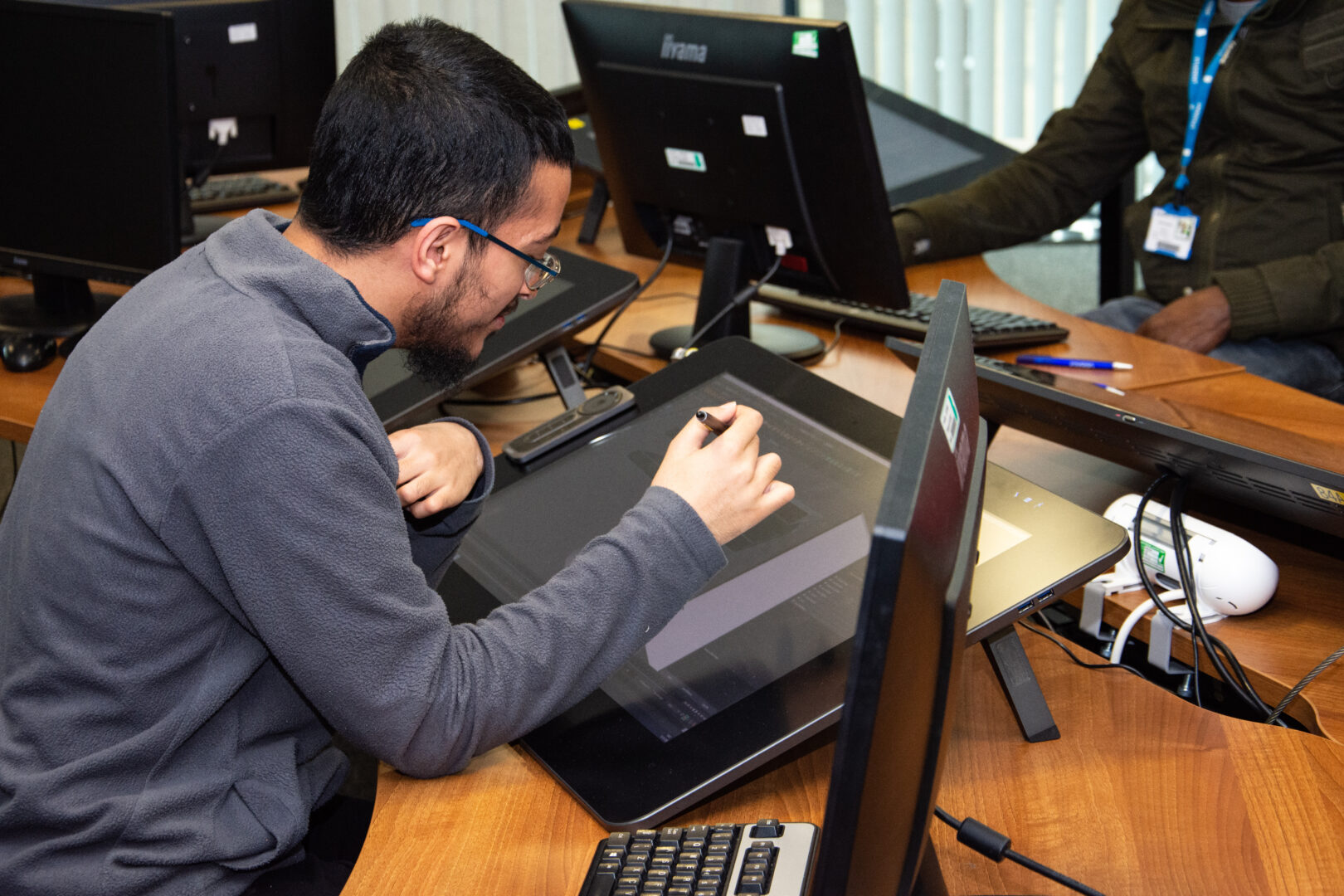 a student working on a large screen
