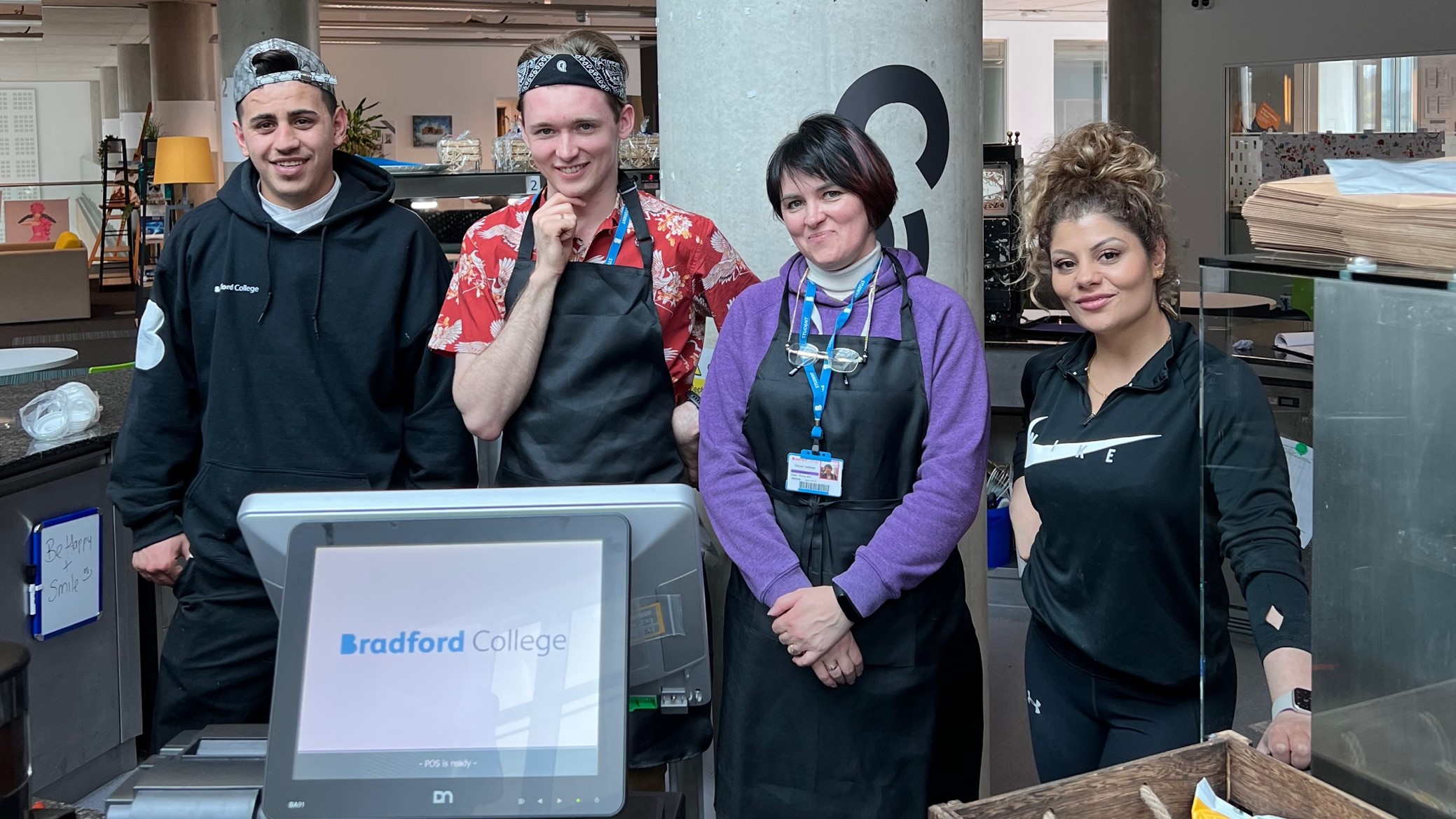 four students stood behind the desk at the Jo Cox Cafe