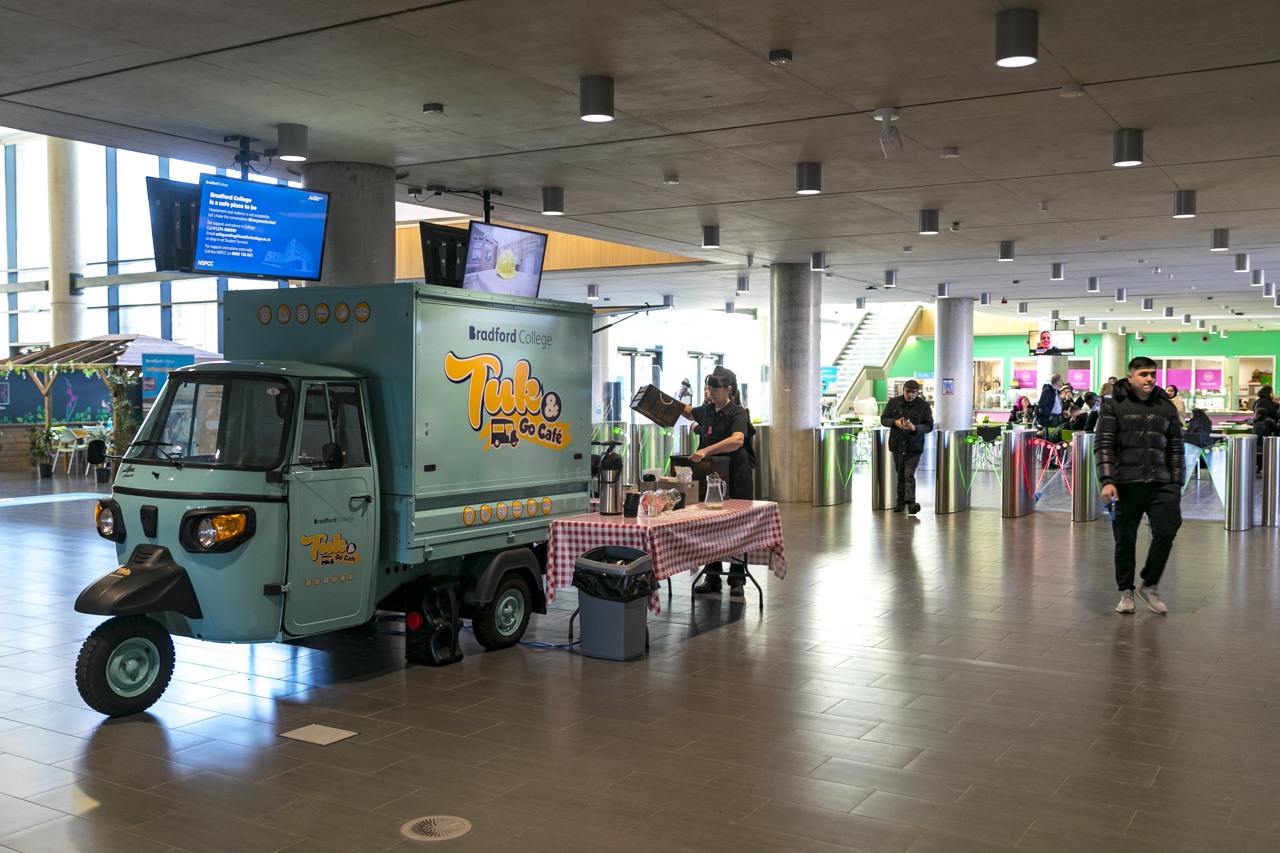 the marketplace area of the david hockney building with the tuk and go cafe in view