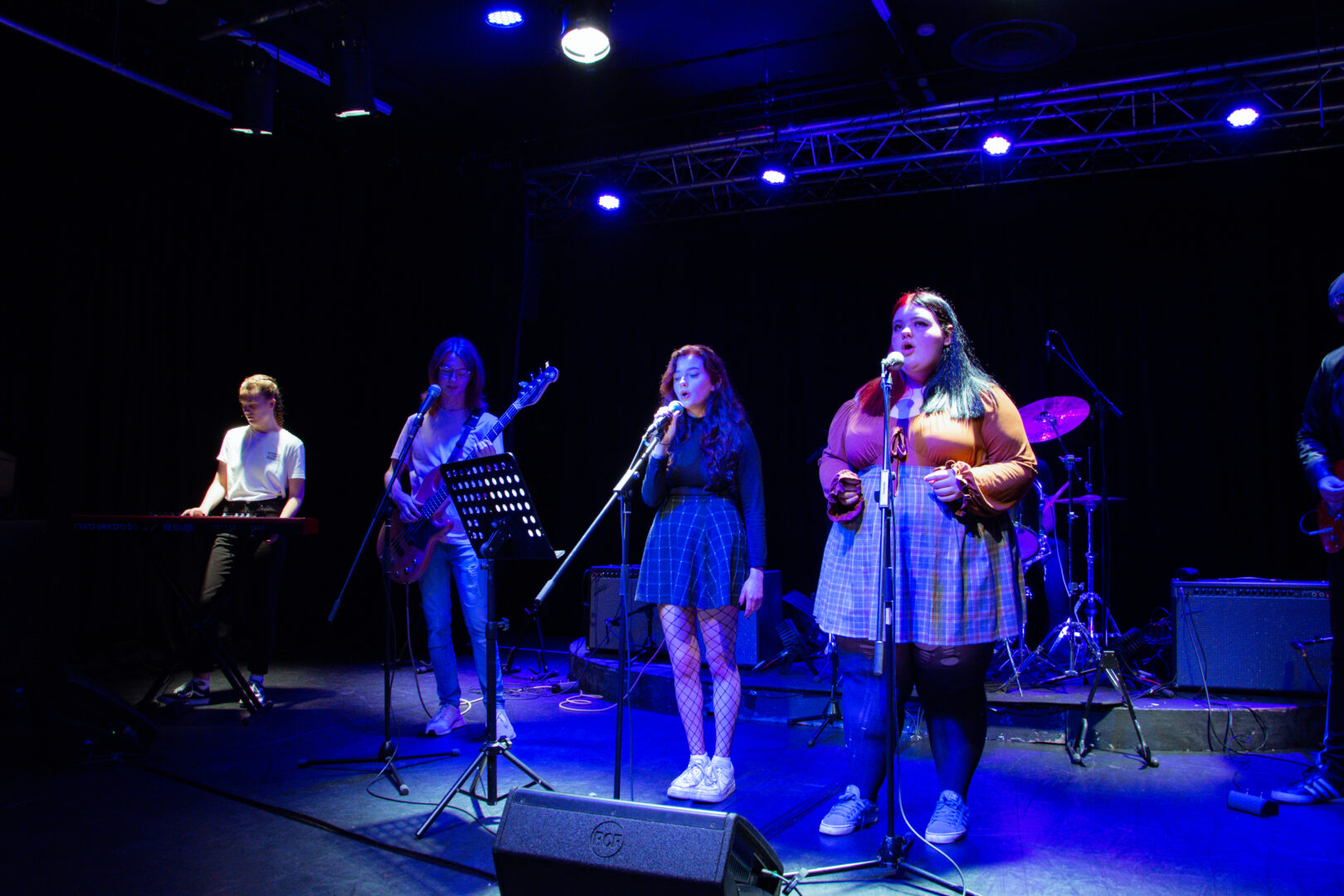 a female led student band featuring singers, guitarists, drummers and a keyboard player