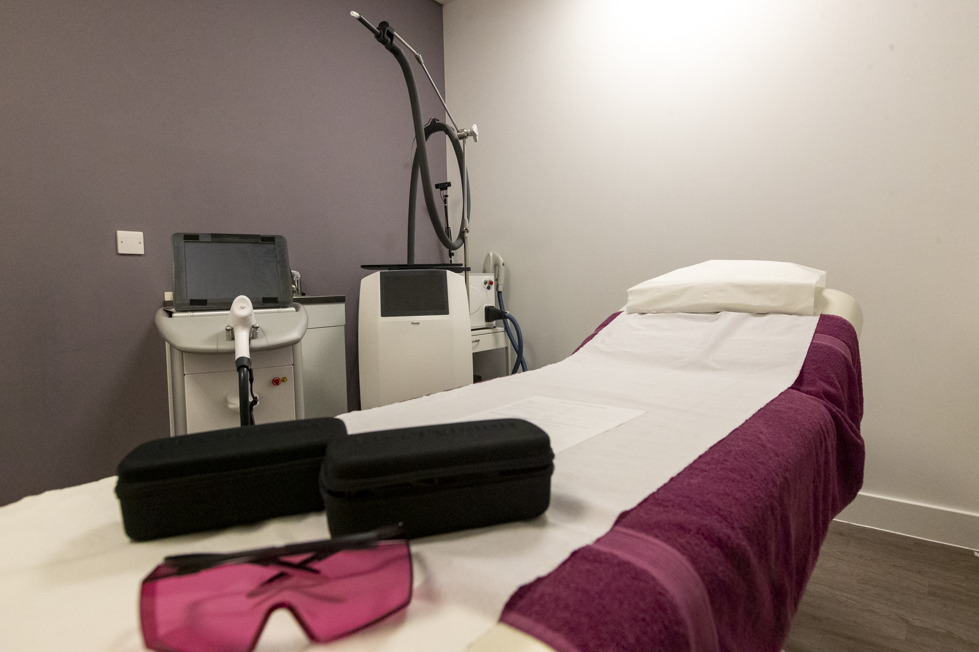 an indoor image of the signature spa and salon with a bed and laser and IPL treatment