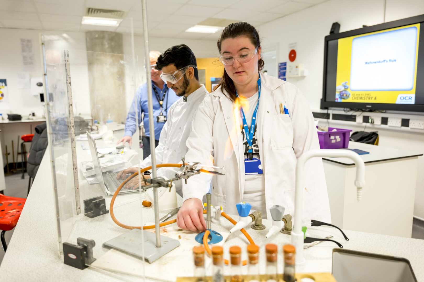 applied science student in the science classroom working with test tubes