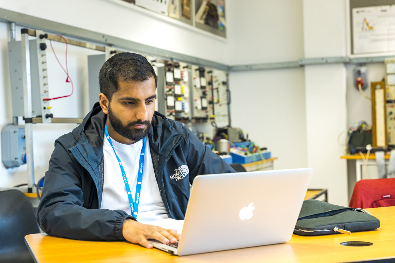 a student sat working on a laptop