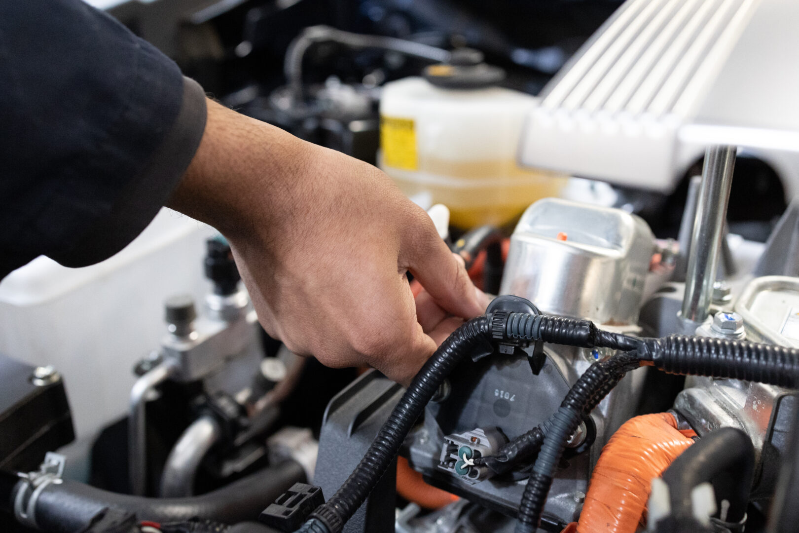 A student working on a car