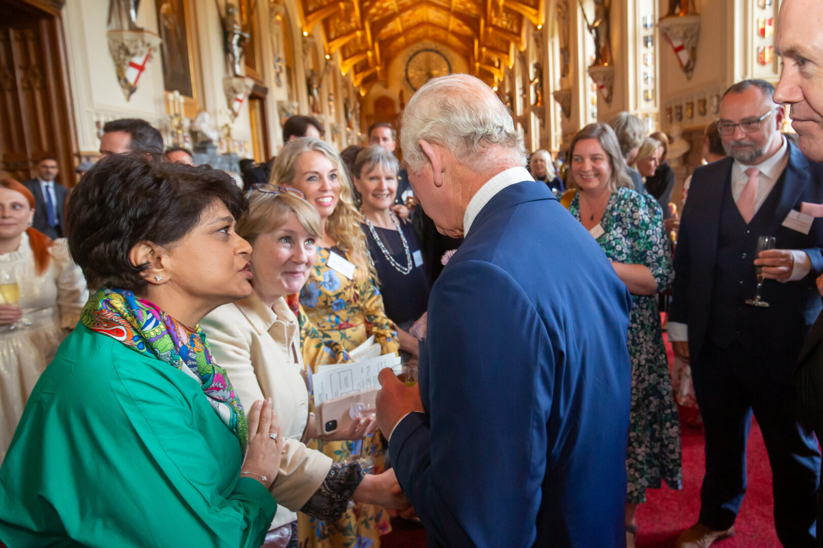 our esol lecturer, esther wilkey, pictured with hrh king charles at buckingham palace