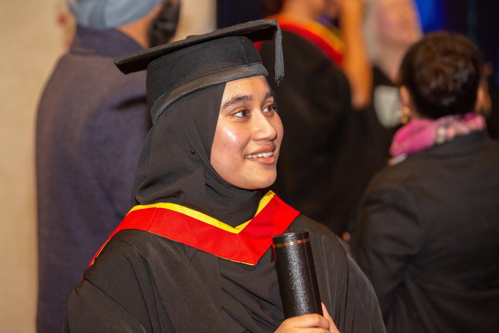 a student smiles as she collects her award