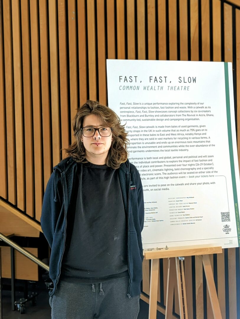 leon ivic, a media makeup with special effects student, stood next to a board reading fast, fast, slow as well as the project being put on by bd is lit