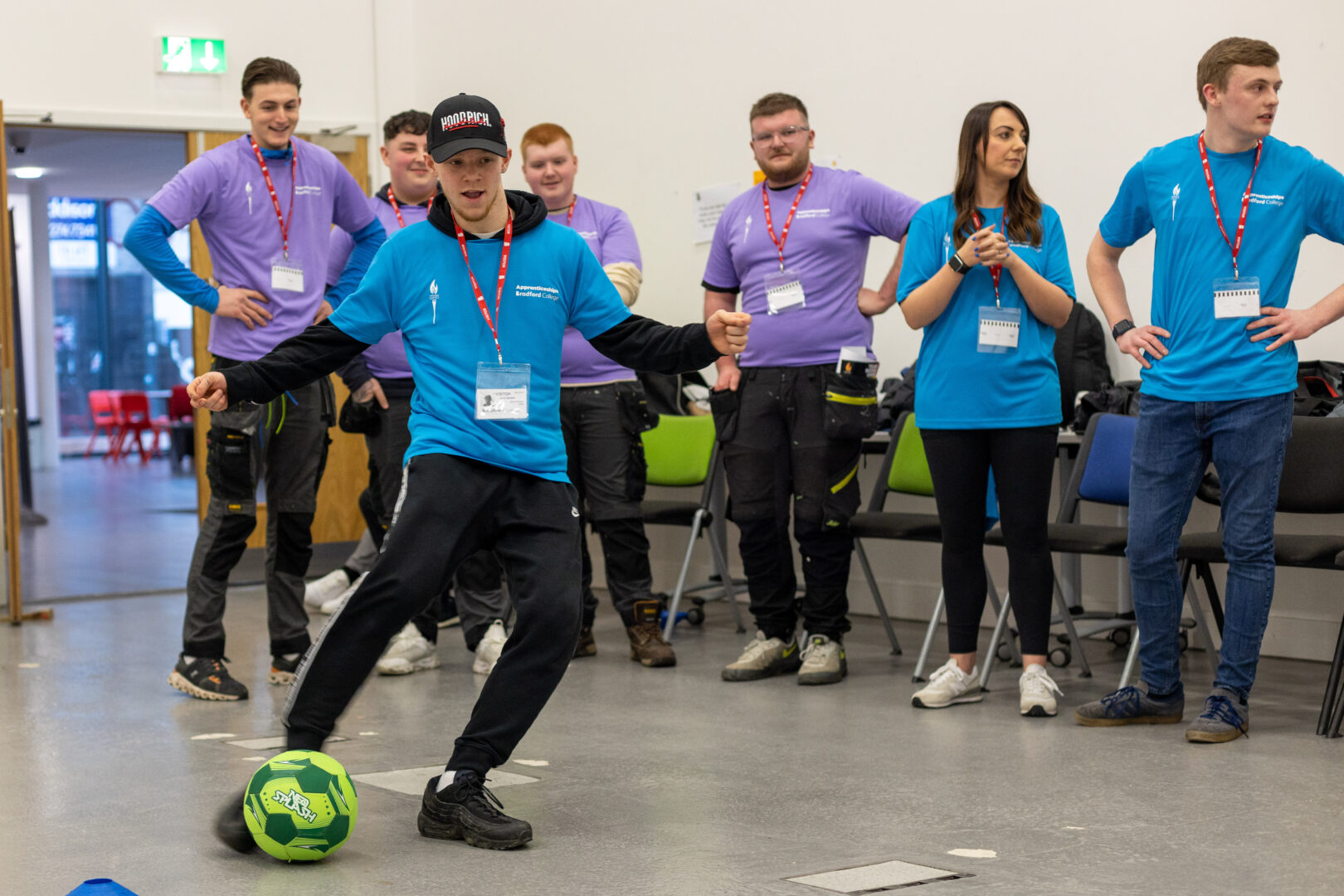 a member of the jct600 team kicks a ball at a goal