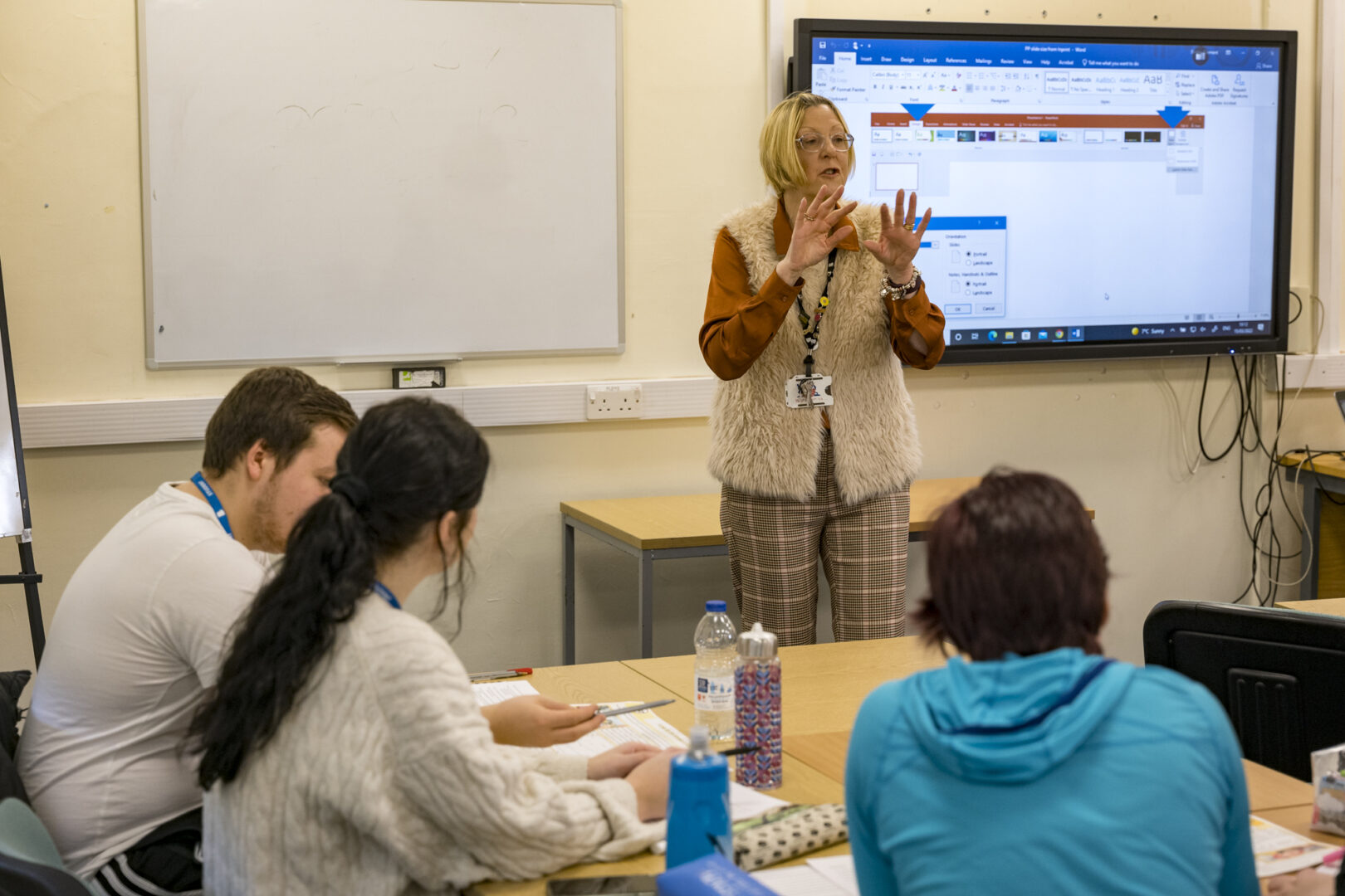 A Teacher presenting to a class