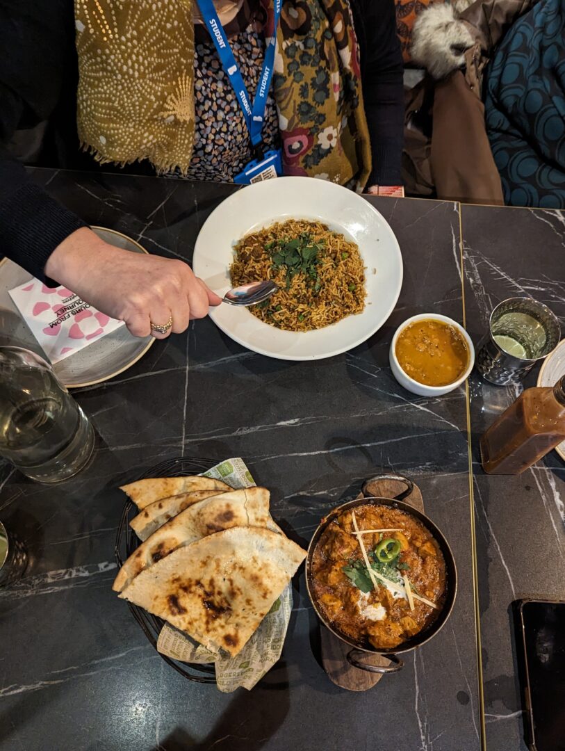 a table top is filled with food and drinks