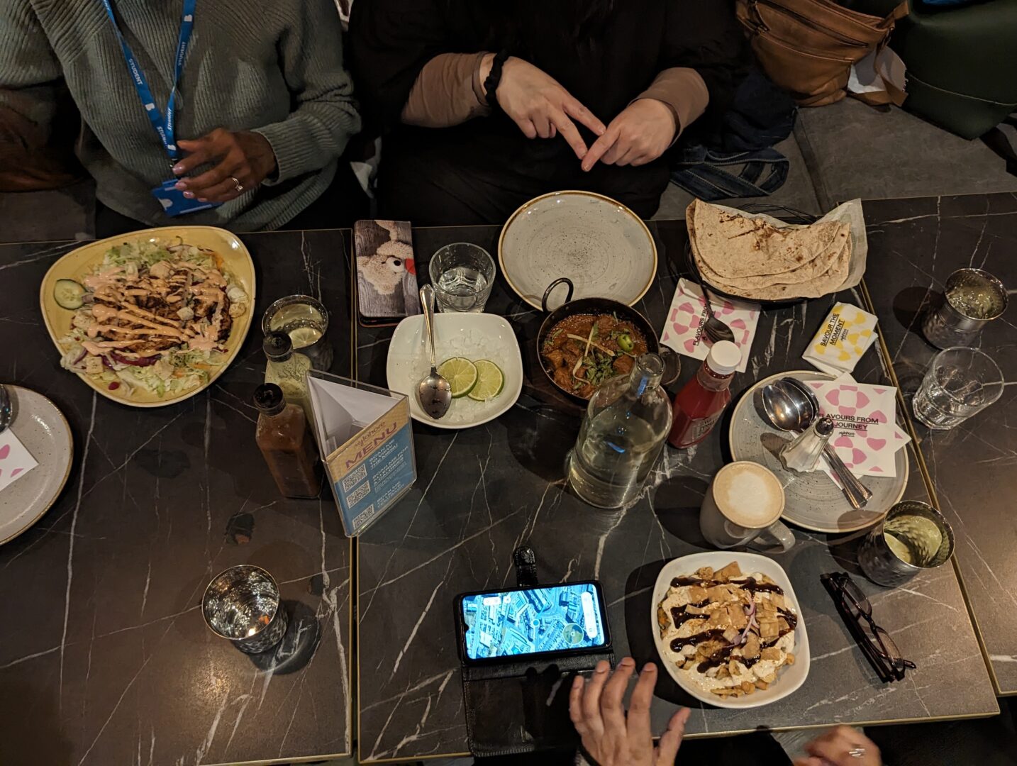 a table top is filled with food and drinks