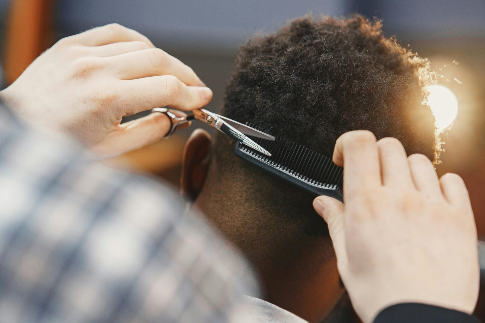 A student cutting hair