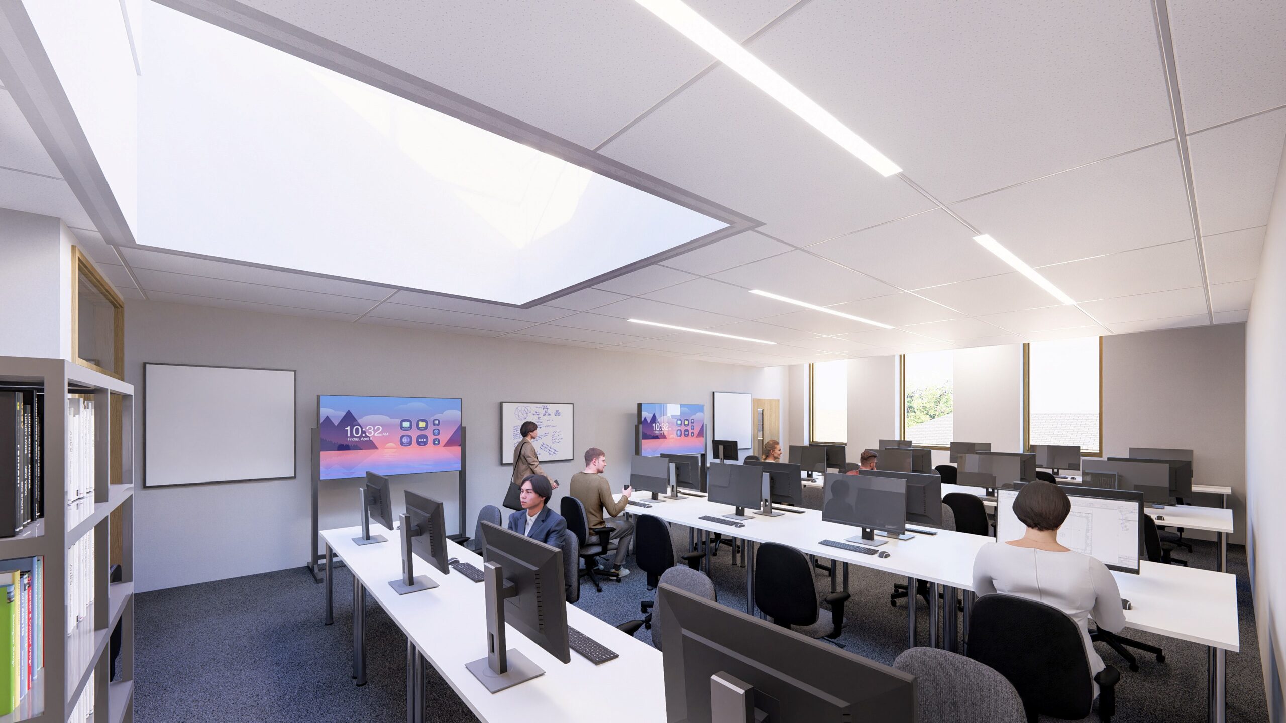 a brightly lit classroom with desks and computers on them