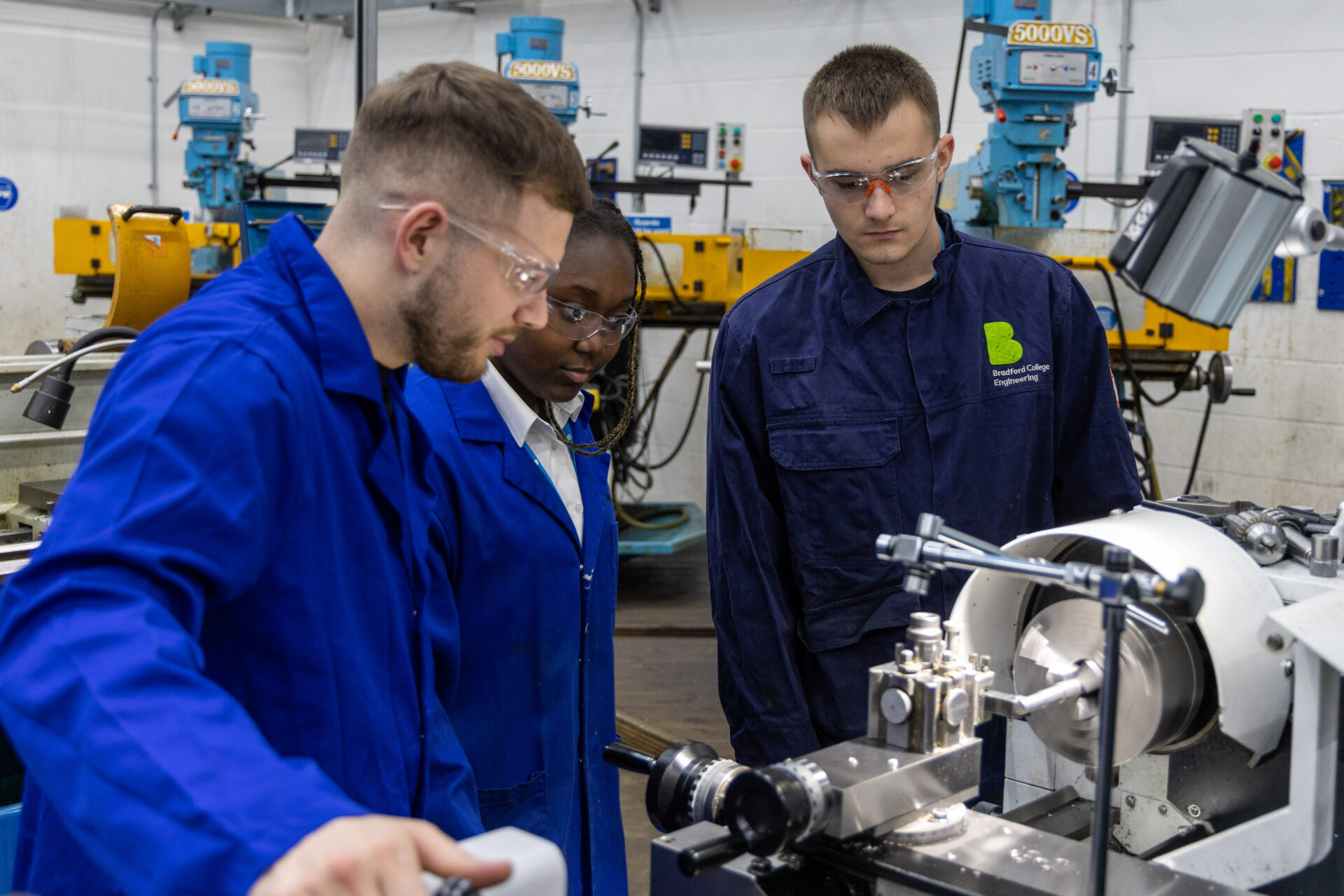 Male tutor with female and male student in our engineering facilities