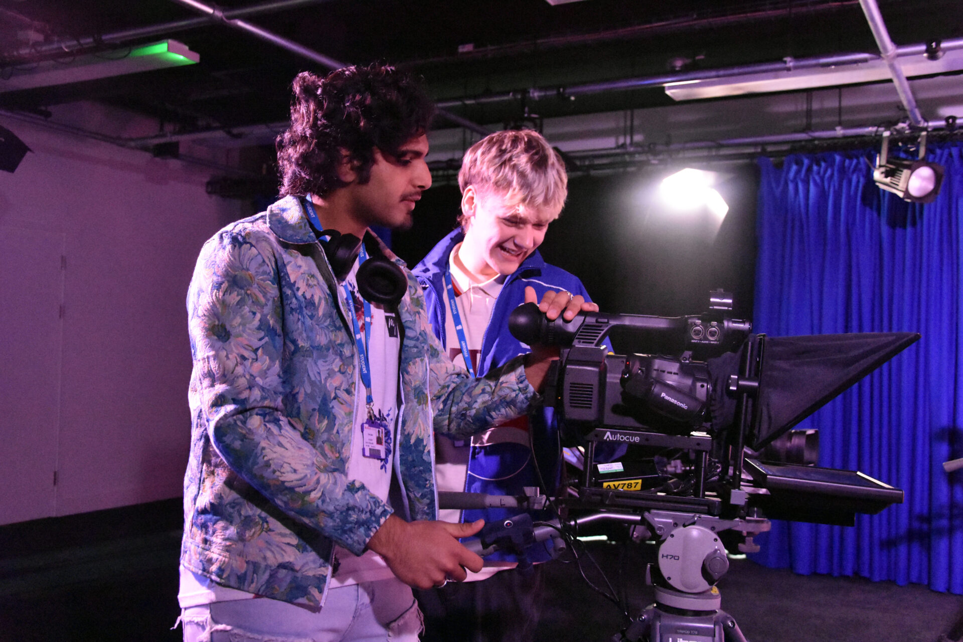 Two media students with cameras in the College's Media facilities