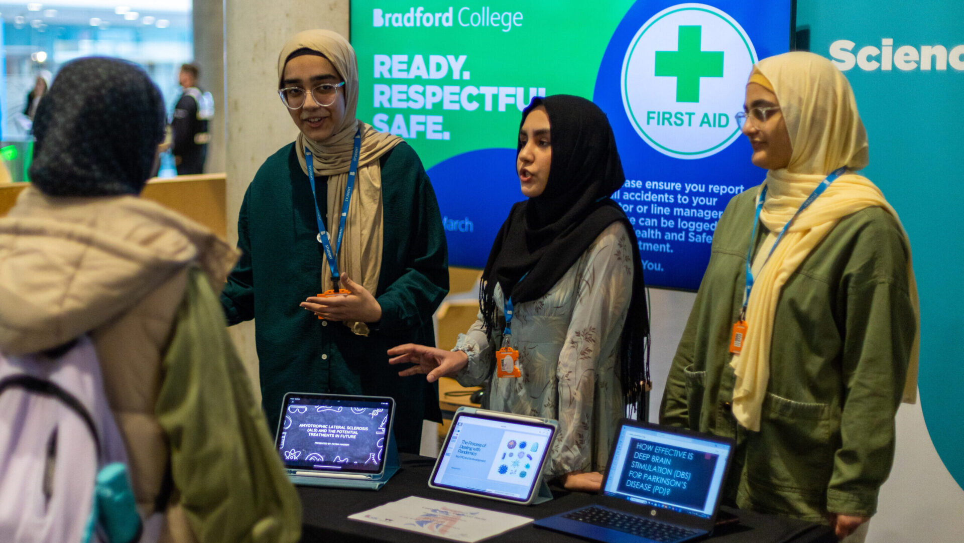 Image of 4 female students showcasing their medical knowledge