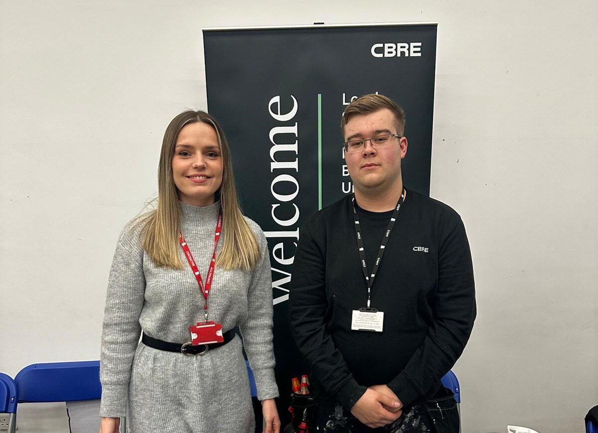 Electrical Installation Apprentice, Sheldon, pose with a female representative from CBRE