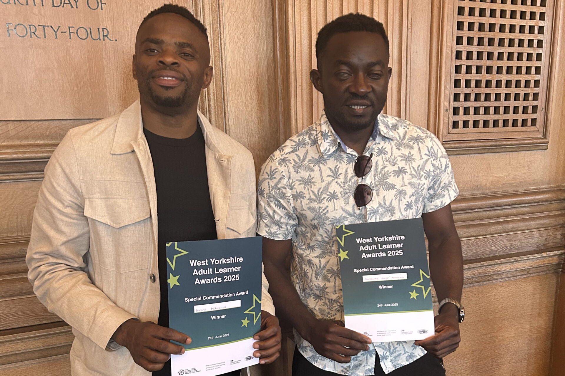 An image of 2 students winning an award