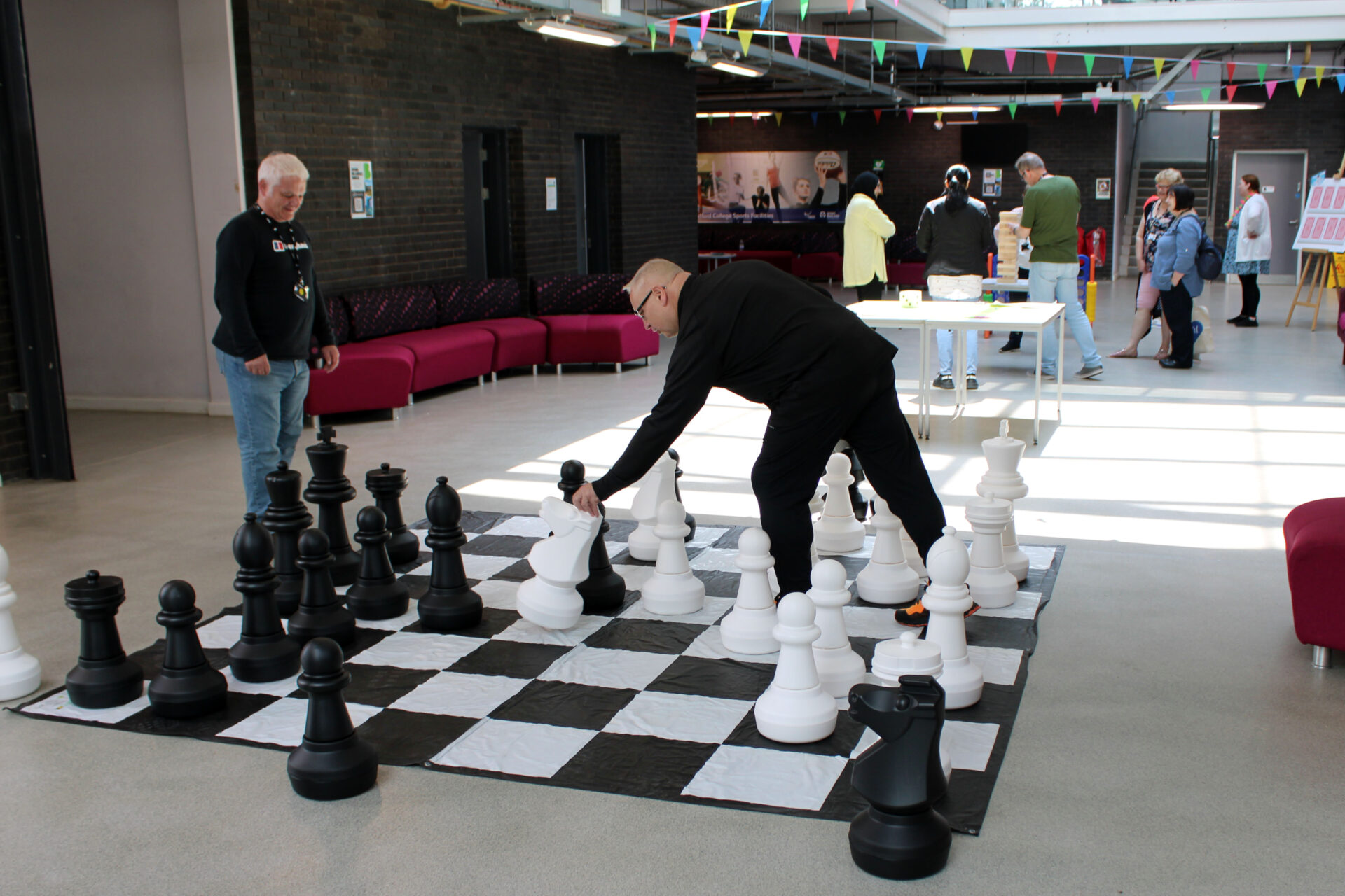 An image of Bradford College staff taking part in games at staff Sports Day