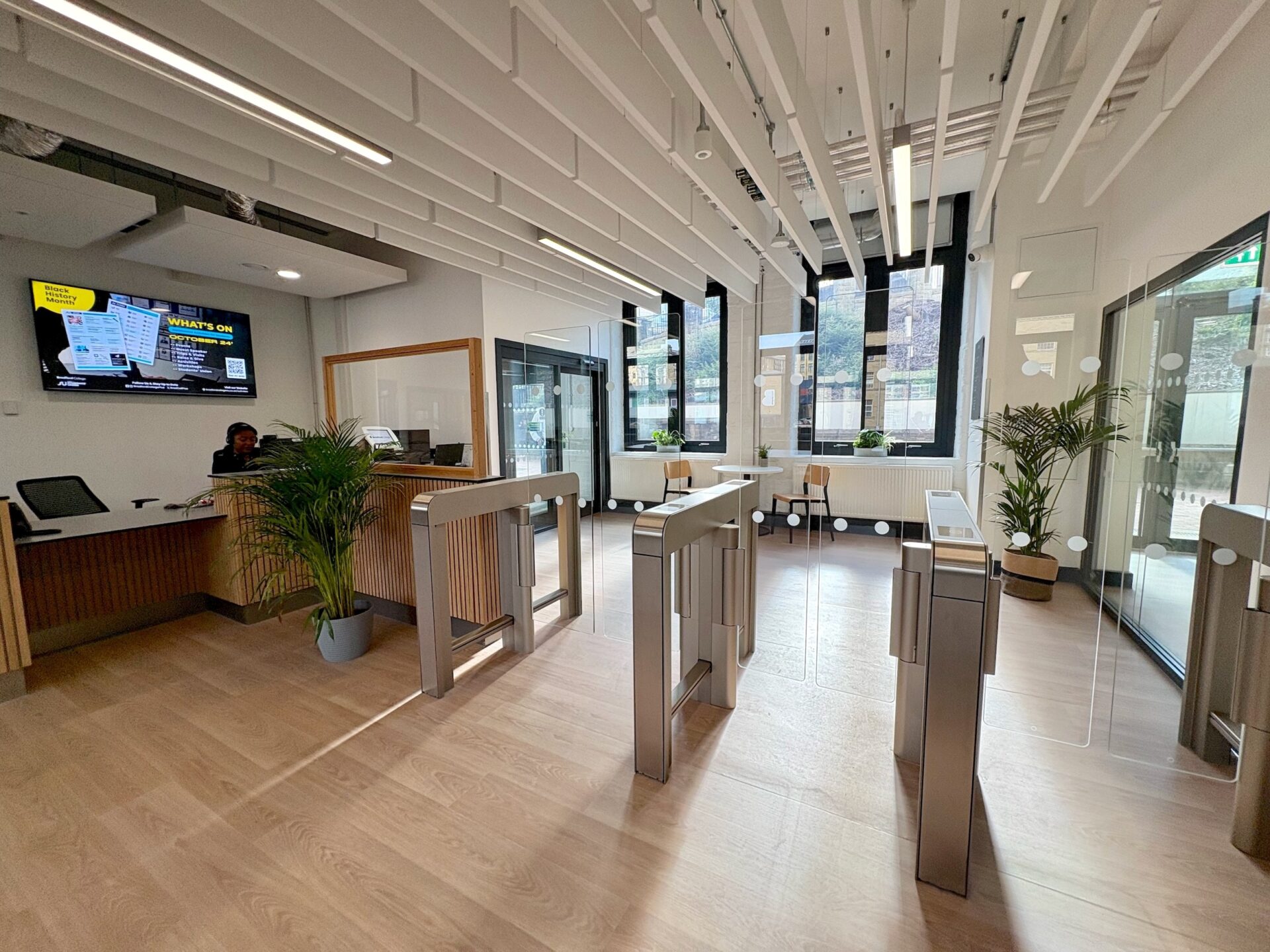 Reception of Gardens Mills image of a desk and glass barriers 