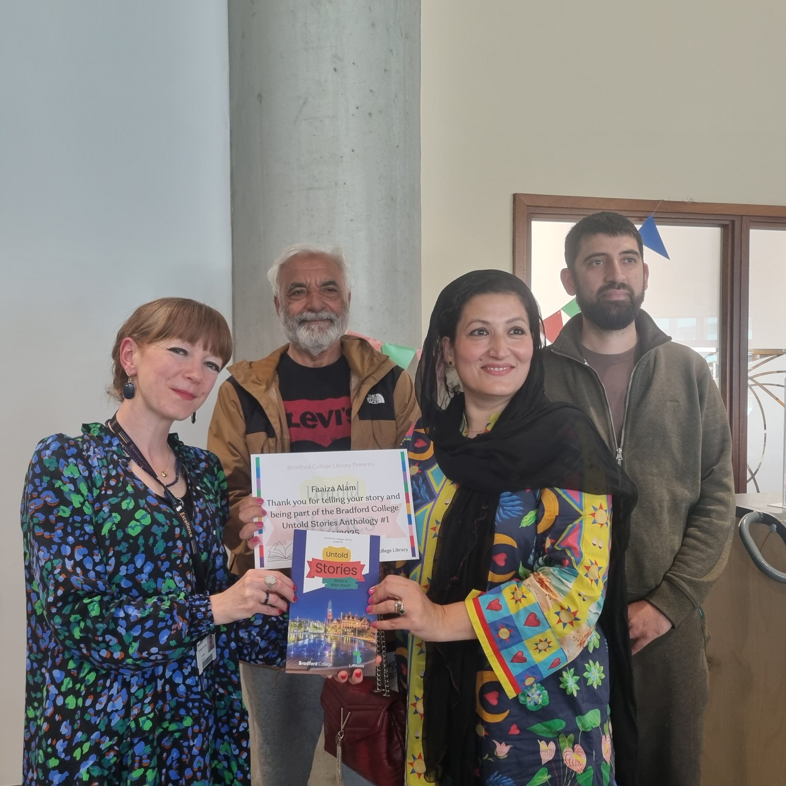 An image of Authors receiving their certifcates