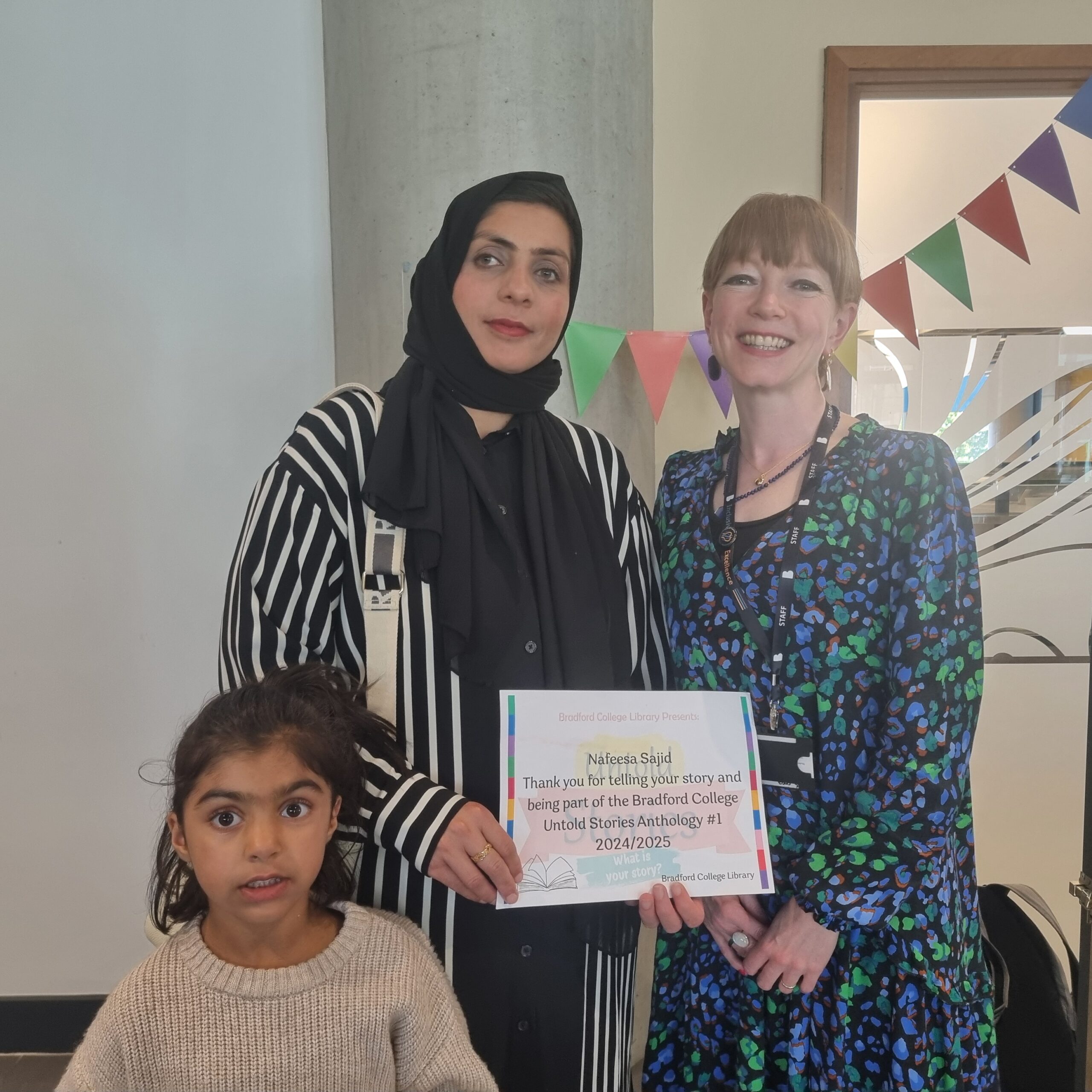 An image of Authors receiving their certifcates