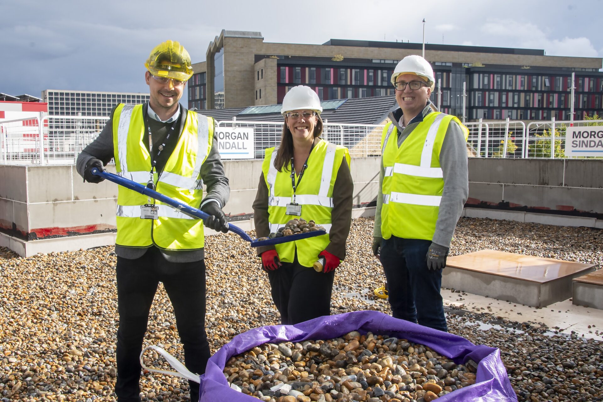 An image of Stephen Smith, Pam Sheldon and Chris Malish at the Topping Out Ceremony