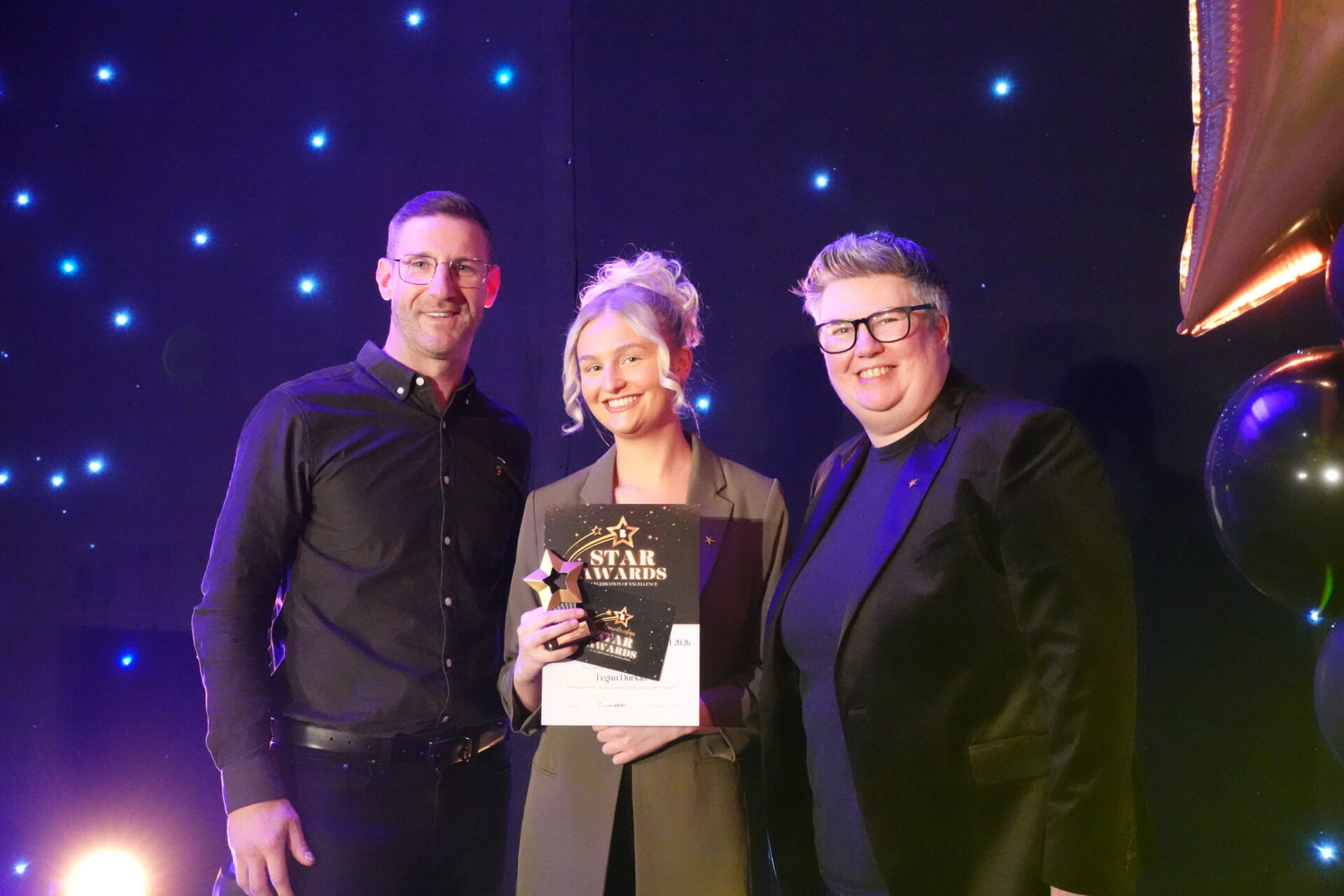image of Tegan the winner of the Star award with Sarah Towan and Chris for CBRE